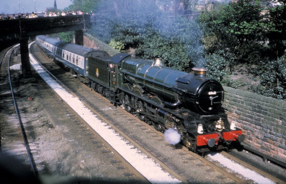 6000 'King George V' passes under the city walls at Chester 1975