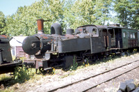 E84 is a Esslingen built 2-6-0 tank of 1886. Here it is dumped out of use at Lousado.