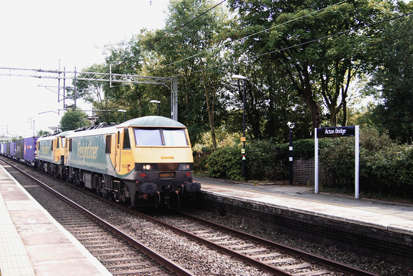 Two Class 90s headed by 900045 on a northbound Freightliner intermodal  train at Acton Bridge. August 2017