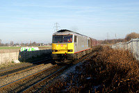 60099 on Fiddlers ferry coal hoppers. 16/01/12