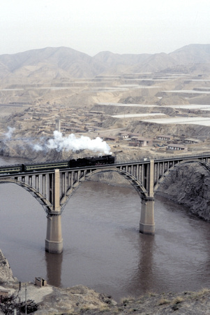 QJ on passenger train crossing the Yellow River at Lanzhou