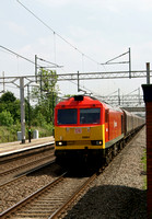60054 in new DBS livery heads north on coal hoppers through Acton Bridge. 20.05.12