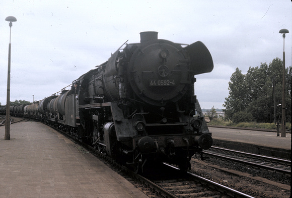 Oil burning 44 class 2-10-0 44.0592 enters Eberswalde station on a train of oil tanks.1978